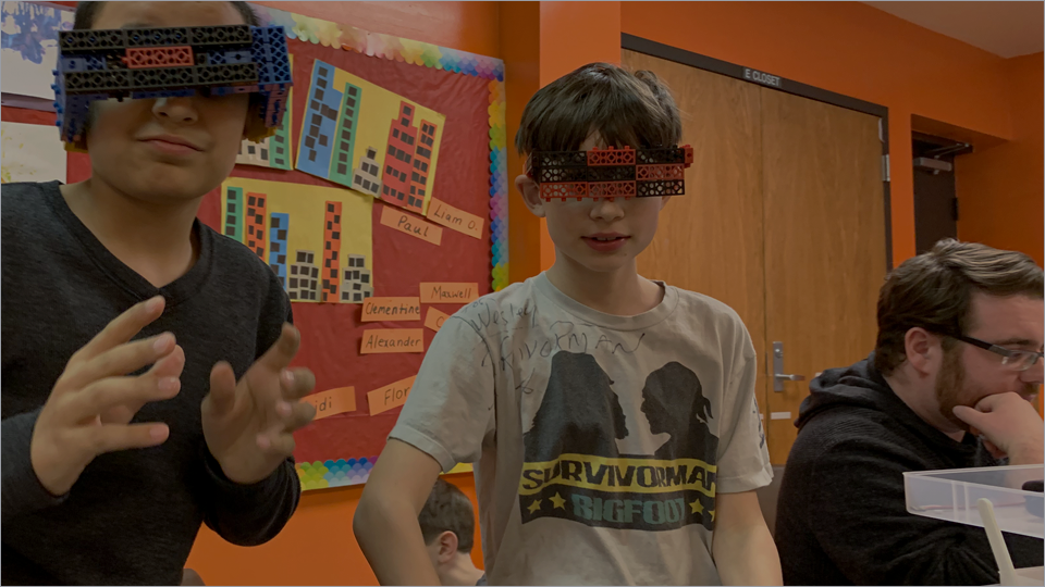RoboThink franchise owners and students in a hands-on STEM session